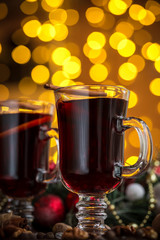 Christmas hot mulled wine with spices on a wooden table. The idea for creating greeting cards