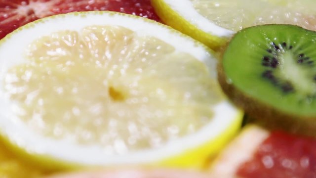 different types of fruit slices of orange, grapefruit, lemon, kiwi