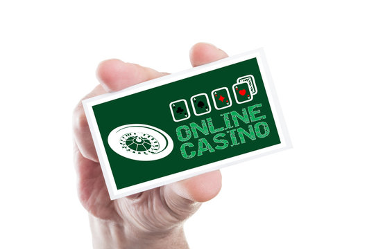 Hand holding online casino card with roulette and four aces