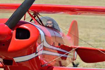 Model airplane engine and propeller with a doll-pilot