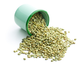 unroasted coffee beans in green mug