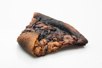 burnt slice of pizza on white background