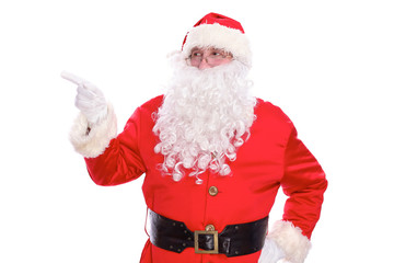 Kind Santa Claus pointing in white blank sign, isolated on white background