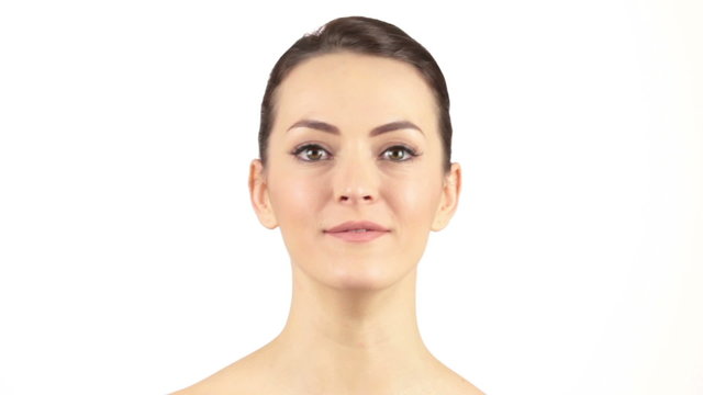 Attractive woman with her mouth open pulling faces