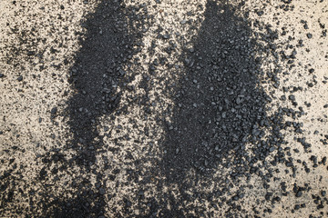 Close-up asphalt at the road under construction.