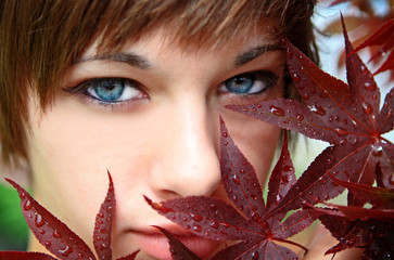 Portrait of a Young Woman behind a tree.