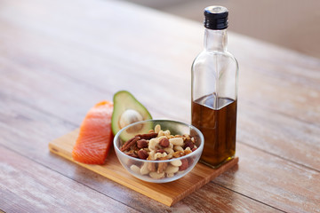 Obraz na płótnie Canvas close up of food and olive oil bottle on table