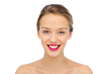 Obraz premium smiling young woman face and shoulders