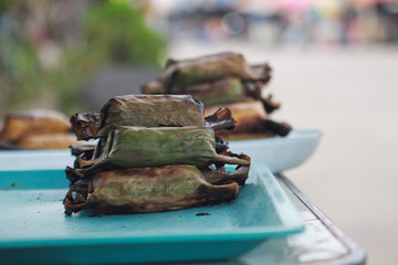 Dessert wrapped in banana leaves