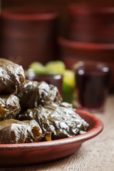 Traditional Greek dolma with meat in grape leaves, yogurt sauce,