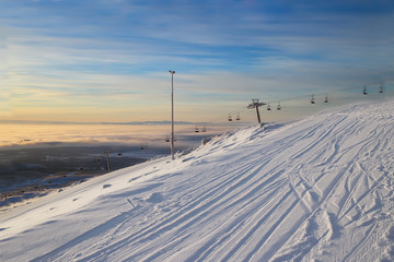 Fototapeta na wymiar The ski resort. lift. Morning.