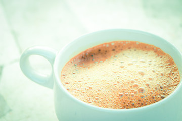 Cup of coffee with vintage tone style.