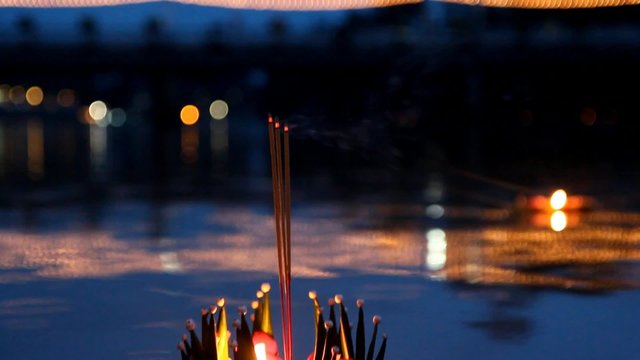 Decorated lamps on the river at the feast Yee Peng & Loi Krathong Festivals