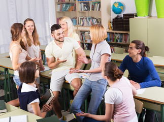 Happy students during break in classroom