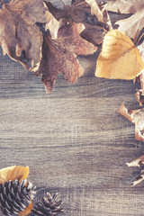 Autumn frame background on a wooden surface
