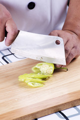 Chef cutting pepper for slice