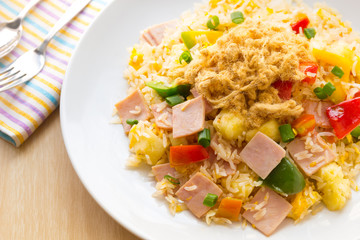 Thai food fried rice with ham, and pineapple.