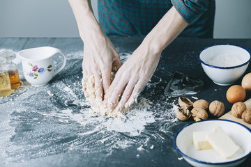table with cookie cutter flour and various ingredients