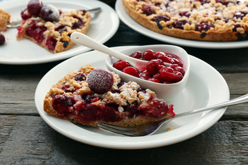 Tasty homemade pie with cherries on table close up