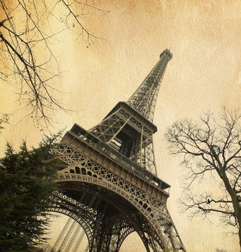 Eiffel tower. Photo in retro style. Added paper texture.