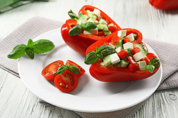 Fresh green salad in pepper on table close up