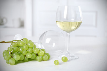 Still life of wine and bread on light background