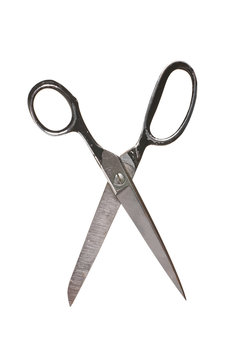 Photo of an old rusty scissors isolated on white background. Studio shot