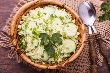 Salad, couscous with cucumber and green onions.selective focus