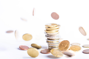 Euro coins. Euro money on a white background. On a one hundred banknote. Lots of coins on the other position