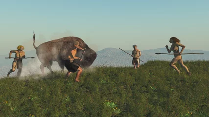 Foto auf Acrylglas Gruppe von Neandertalern, die einen Bison jagen © nicolasprimola