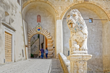 Lion statue guarding Palazzo Orsini, the center of Pitigliano