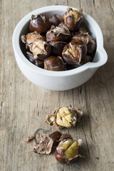 Chestnuts in a white pot