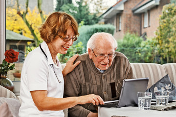 Nurse caring for elderly person
