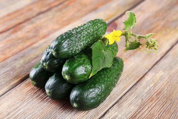 Cucumbers on wooden background