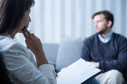 Female psychiatrist talking with patient