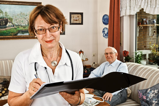Nurse caring for elderly person