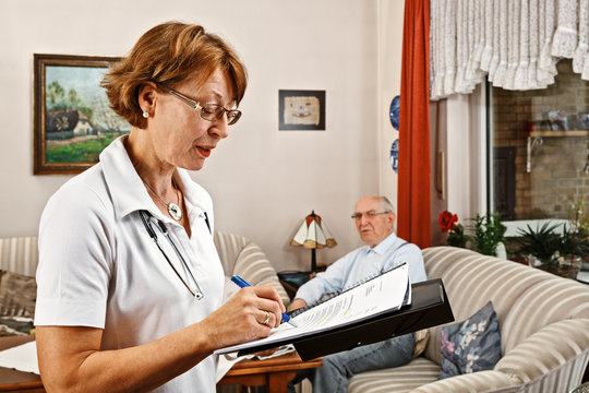 Nurse caring for elderly person