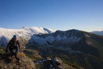 Fototapeta premium Girl meditates in the mountains.