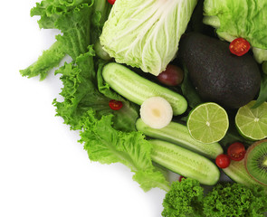 Close-up composition of various raw organic vegetables and fruit isolated on white