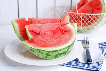 Sliced watermelon on white plate