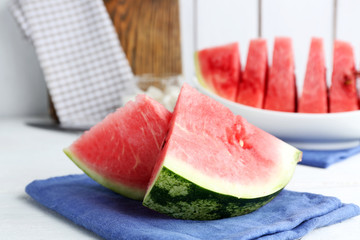 Sliced watermelon on blue cotton napkin