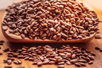 Flax seeds linseed on wooden spoon