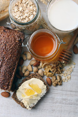 Healthy breakfast with bread, honey, nuts. Country breakfast concept