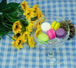 colorful macaroons on checkered tablecloth
