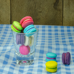 colorful macaroons on checkered tablecloth