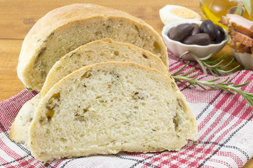 Sliced olive bread with seeds and olives
