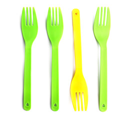 Disposable colourful forks isolated on white, top view, Individuality concept