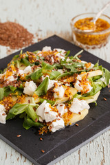 Salad with apples,cheese and herbs, seasoned with mustard sauce.