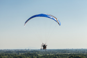 aerial view of paramotor flying over the fields