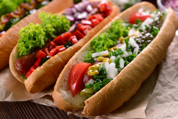 Hot dogs and vegetables on craft paper closeup